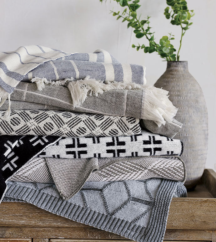 Elevate your space with our 100% cotton throw blanket! Featuring a classic windowpane plaid pattern, it adds a timeless touch to any room. Flip it for a stylish two-tone gray and white look, with polished fringe edges and square corners. Easy care, toss in the wash, and enjoy its beauty.